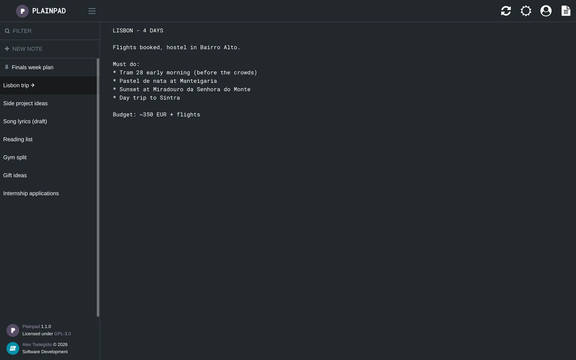Plainpad in dark mode with a Lisbon trip note open